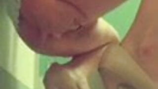 Milf plays with pussy in bathroom at work
