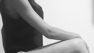 enjoying herself with strapon and fingering