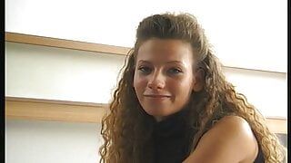 cute girl lolls on the bed and shows her willing cunt